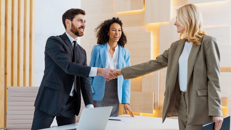 group-of-multiethnic-businesspeople-shaking-hands-for-a-business-deal.jpg